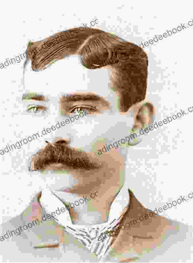 A Black And White Photograph Of Raymond Carver, A Middle Aged Man With A Mustache And Short Hair, Wearing A Button Down Shirt And Tie. He Is Sitting At A Desk, Looking Directly At The Camera With A Serious Expression. The Penguin Of The Modern American Short Story