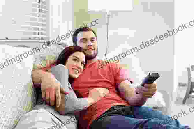 A Man And A Woman Sitting On A Couch Together, Talking And Laughing. The Woman Is Leaning Into The Man's Shoulder. DATING FOR THE MODERN MAN: Simple Things Women Want Men To Understand