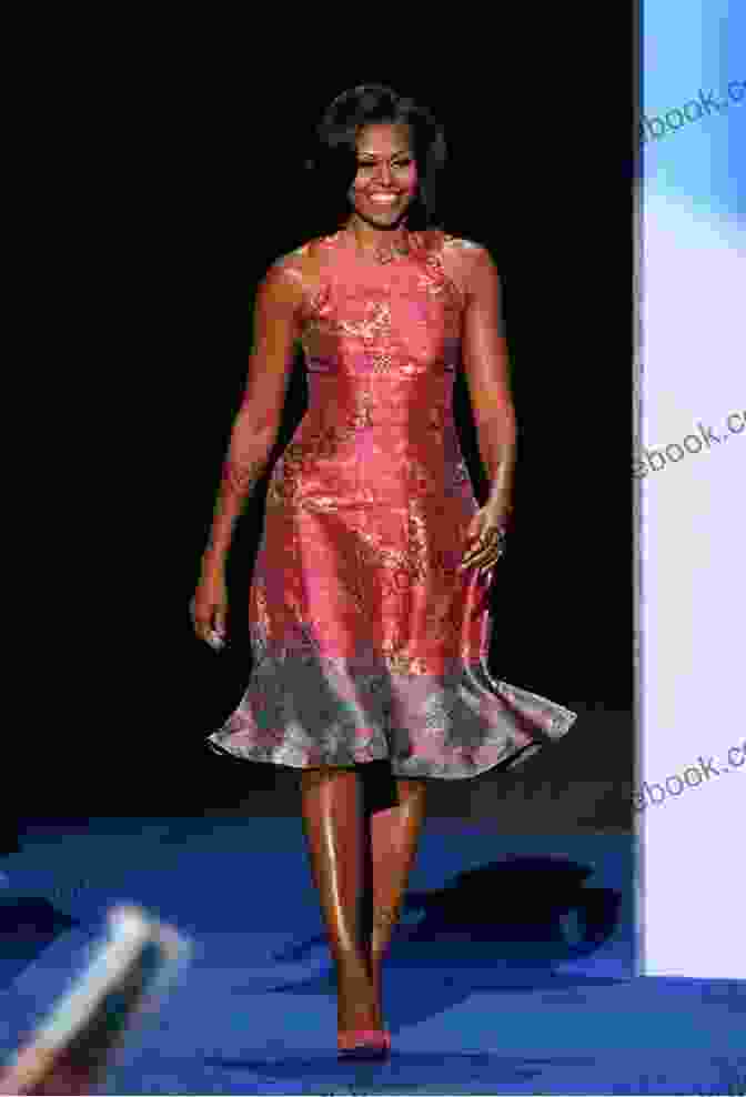 A Photograph Of Michelle Obama Smiling And Waving, Dressed In A Red Dress. The Image Is Set Against A White Background. Laura Bush: An Intimate Portrait Of The First Lady