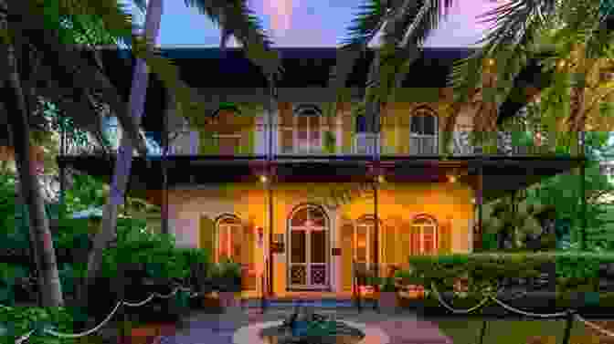 A Photograph Of The Hemingway Home And Museum In Key West, Florida, With Several Cats In The Foreground. Hemingway S Cats: An Illustrated Biography