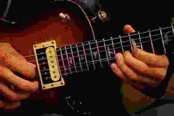 Guitarist Using Vibrato Technique On Guitar Strings Country Guitar Soloing Techniques: Learn Hot Country Hybrid Picking Banjo Rolls Licks Techniques (Learn How To Play Country Guitar)